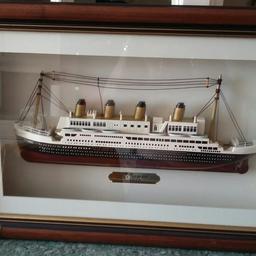 This is a very nice model of the Titanic in a frame.