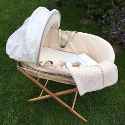 Need gone ASAP. Beautiful basket from Izziwotnot in natural colour. Comes with the original bedding, detachable hood and a couple of blankets. The mattress is a breathable from Mamas and Papas. All fabrics are washable, even mattress cover. Foldable stand which is easy to open and store away.