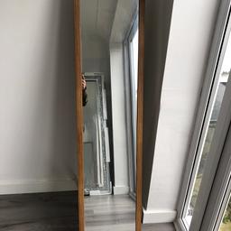 Free standing mirror has legs at rear to keep stable. Collect aintree