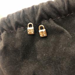Tiny locks with silver screws and branding.
No backs included.