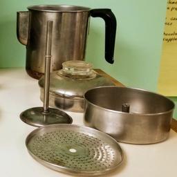 Silver stove top percolating coffee maker.  5 - 6 cup.  Very clean...I added the last pic after scrubbing the pot.  Appears to have a copper bottom. Located in Pataskala (central), Ohio.  Buyer pays for US shipping if needed. 
Let me know if you need any other pics or info. 
(Cross posted)