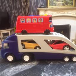 Long lorry truck with cars inside
Bus also included