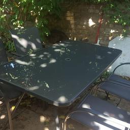 Garden set. glass top table, and 6 chairs for only £50. Worth £120.