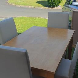 pine table and cream four chairs good condition but been in storage a while might need a clean local delivery possible for asking price