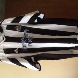Newcastle top size large. In immaculate condition.