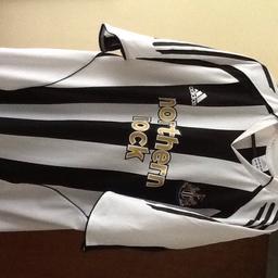Newcastle football top immaculate condition.
Size large.