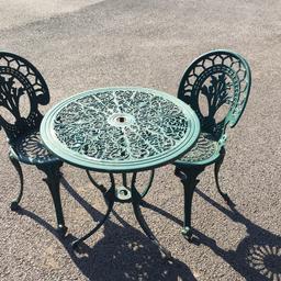 Metal garden table and 2 chairs. Paint is peeling but still really sturdy. Could be repainted/ up-cycled.