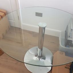 Glass dining table with silver base.
Comfortably sits 4 ppl.

Height: 75cm
Diameter: 100cm

Corner is chipped, please refer to pictures.

Collection only from Southfields Station SW18
