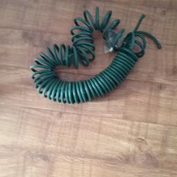 Green curly garden hose 25 feet long approx with connectors