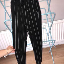 Black and white striped pretty little thing pants size 6 but could fit a 4 as well 
Bought for £20
Collection only 