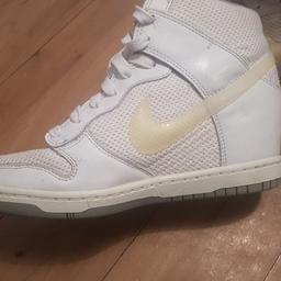 Nike white wedge high tops. 
Size 5 
great condition.