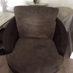 Light brown material and darker brown base swivel chair. Collection only