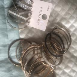Genuine DKNY watch, a huge bundle of bangles and 3 pairs of big hoop earrings Never used. Collection only