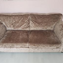 selling my champagne colour velvet sofa, 3 seater sofa, 1 chair and a pouffe. very good condition. pouffe has a few Mark's on. no rips or tears. £120 