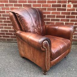 A stunning antique style conker brown leather armchair with a solid turned wood legs from BARKER & STONEHOUSE.

The high back and deep seat cushion allowing you to fully relax into it.

Wonderful large stud detail to the front 

There are some use evicences expected of a used item although no rips or tears and has been given leather feeder to bring out the natural colour of the hide.

100cm H X 96cm W X 96cm D

Collection from Birstall WF17 or delivery within 50 miles for an additional fee.