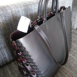 real leather, new with tags. 
colour: graphite/black/grey dependig of light colour is changing.
additional has a long strap. 
looking very smart.