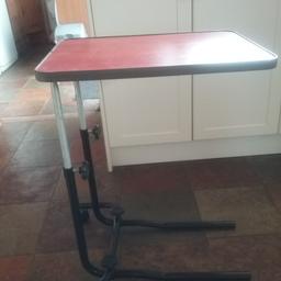 Handy over bed or chair table, adjustable height and on castors for easy manoeuverability also goes under wheelchairs