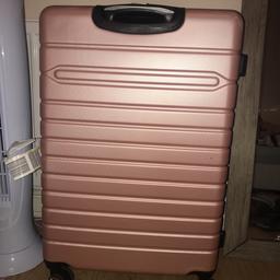 Large pink hardback suitcase with code. 4 wheels at bottom so easy to pull. Used only once so in very good condition. Payed £45 brand new only in July 2019
