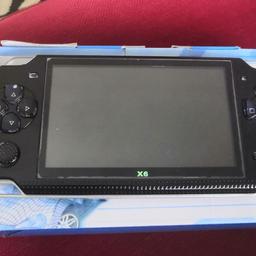 Young version of PSP with pre loaded games 1500 plus games. Played on once like new with box. Games include batman, spiderman, pac man, snake, football, space raiders, Mario, sonic. Very good gaming system my little one just doesn't bother with it due to his tablet. With charger and box