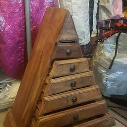 6 drawers in a pyramid style could be MANGO wood , nice piece of furniture.can deliver locally