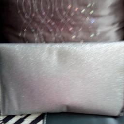 Used bag envelope type in silver with strap great for Christmas great condition