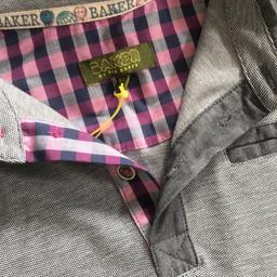 BRAND NEW still with tags. Grey Long sleeve top with button pocket and navy and pink detail.  
Beautiful shirt. 
Age 8/9
