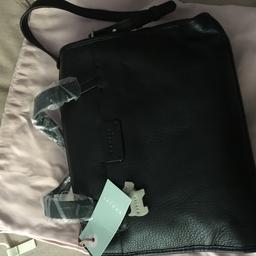 This is a brand new Radey Handbag.
Never used. 
All labels still attached and plastic covering on the handles.

Internal pockets.
Short handles and long strap.

Comes with original dust bag.

Will post for £5
