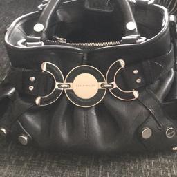 Genuine Karen Millen Black leather bag.
Studded end pockets with interior zipped compartment.
Excellent condition