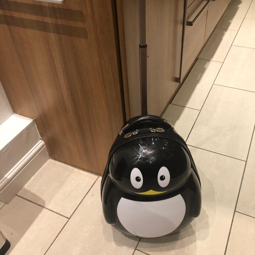 Skyflite store penguin suitcase