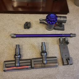 Dyson V6 Cordless Hoover. In good condition and full working order. Holds charge well. Comes with 2 heads, charger and holder to put on wall.