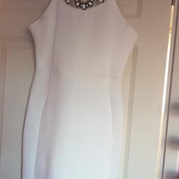 White Boohoo dress. Decorative neckline.
size 14. Worn once