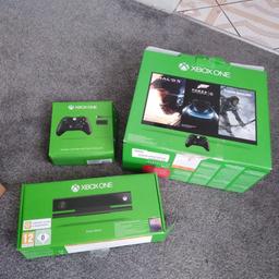 xbox one with kinect, 6 games, one controller and battery pack, charging doc and complete in original boxes