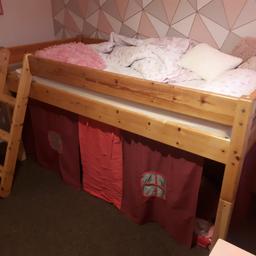 solid pine mid sleeper bed with tent underneath good condition collect only sk1 or I'll swap for a wooden single bed . no mattress Inc