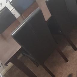 Solid wooden table with 6 brown leather chairs. In very good gondition. This is a very expensive table as it is solid oak. selling cheap as no space for it.