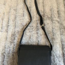 Over the shoulder black bag with lock 
Only used a couple of times