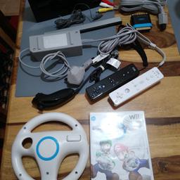 Black Wii console bundle comes with all leads two controllers and one num chuck, including Mario Karts game with its steering wheel as pictured.
All in used condition.