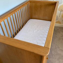 Mothercare cot, purchased from new. This is very sturdy but I’m not sure if it’s oak or oak veneer. I also have a cot mattress ( also from
Mother care and purchased from new), this can be included too, for no extra cost. There are a few bite marks but this isn’t noticeable, please see the attached photo. I also have a waterproof mattress protector however the mattress also has a removable waterproof protector, this sips of the mattress. No stains and from a clean, smoke free and pet free home