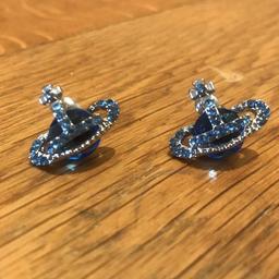 GENUINE Vivienne Westwood Earrings. Silver and a deep blue sapphire coloured stone. 
Simply stunning