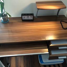 A really good solid desk that looks great and is functional too.
It has a slide out keyboard table plus two drawers and a raised plinth for a printer or speakers etc... 
dimensions
H 74cm
W 109 
D  55cm
