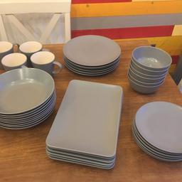Used Ikea dinner set. Colour is classed as grey blue. Everything in very good condition apart from one of the mugs that as a chip as shown in the picture. 
6 x dinner plates
6 x side plates
6 x bowls 
9 x pasta bowls 
6 x serving platter 
6 x mugs 
Collection only