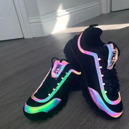 These are the perfect rave shoes! They glow up like the picture shown above when any sort of light is put on them. Including direct sunlights, uv, club light or or flash light. They are good as new and only worn a few times. They are size 5 and have a thick sole.