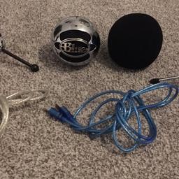 1x Blue Snowball Microphone, 1x microphone cover, 2x microphone stand, 2x microphone lead. The microphone has small tape marks on it, but easily covered by the microphone cover.