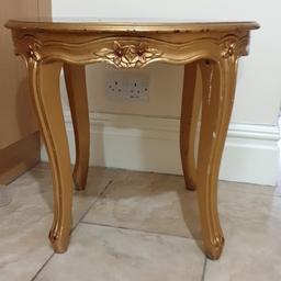 golden small round table
height 19.5 inches
top measures around inches 
located in Old Trafford