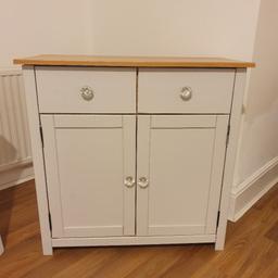 Good little sideboard for sale, I painted this myself in Laura ashley paint and changed the knobs. Selling as no longer require it.

There are a small few chips on it (pictured) and a few small patches of discolouration which wouldn't even show up on the pictures.

The right hand door doesn't stay closed, probably the magnets aren't aligned from when I put it together, so I use a bit of blu tack(pictured) and this works just fine.

Original sideboard pictured also.

H 80cm
W 81.5cm
D 35.5cm