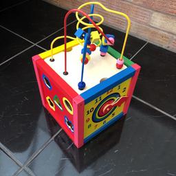 A lovely colourful wooden activity cube.

This includes, 
Chalk board, abacus, shape sorted and clock. 
There is one wooden shape missing. 

Very good condition.