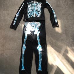 Halloween Skeleton Dress Up Costume
Used Condition as shown in the photo
Age Child 11-12 years Height 146cm-152cm 
George 2 piece set
Pet & smoke free home
Collection Stanground Peterborough PE2 - cash only please