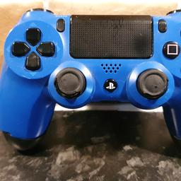 Blue and black PS4 controller 
full working order 
some cosmetic damage ( see pictures )