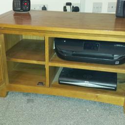 here I have up for sale this great tv stand /cabinet
solid wood with glass door good condition solid heavy unit.