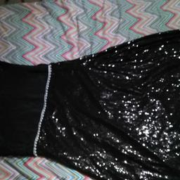 Extra Large. Shiny and black. Good Quality. Never wore before.