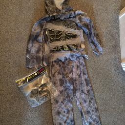 Hear for sale is a Halloween costume age 5/6 only worn once and mask is still brand new hasn’t been opened also makes a zombie noise with a touch button collection only please